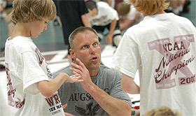 Picture of Swenson with wrestlers